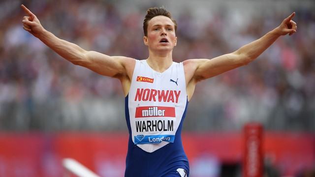 Athlete celebrating in a branded uniform